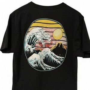 Graphic tee with bold wave design on the back #beachvibe #surfing
